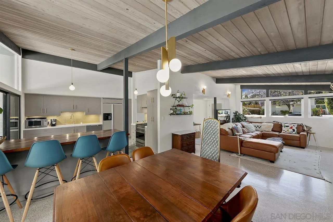 5635 Dartford Way San Diego, CA 92120 - Photo 2 of 26 a living room with fireplace furniture and a chandelier