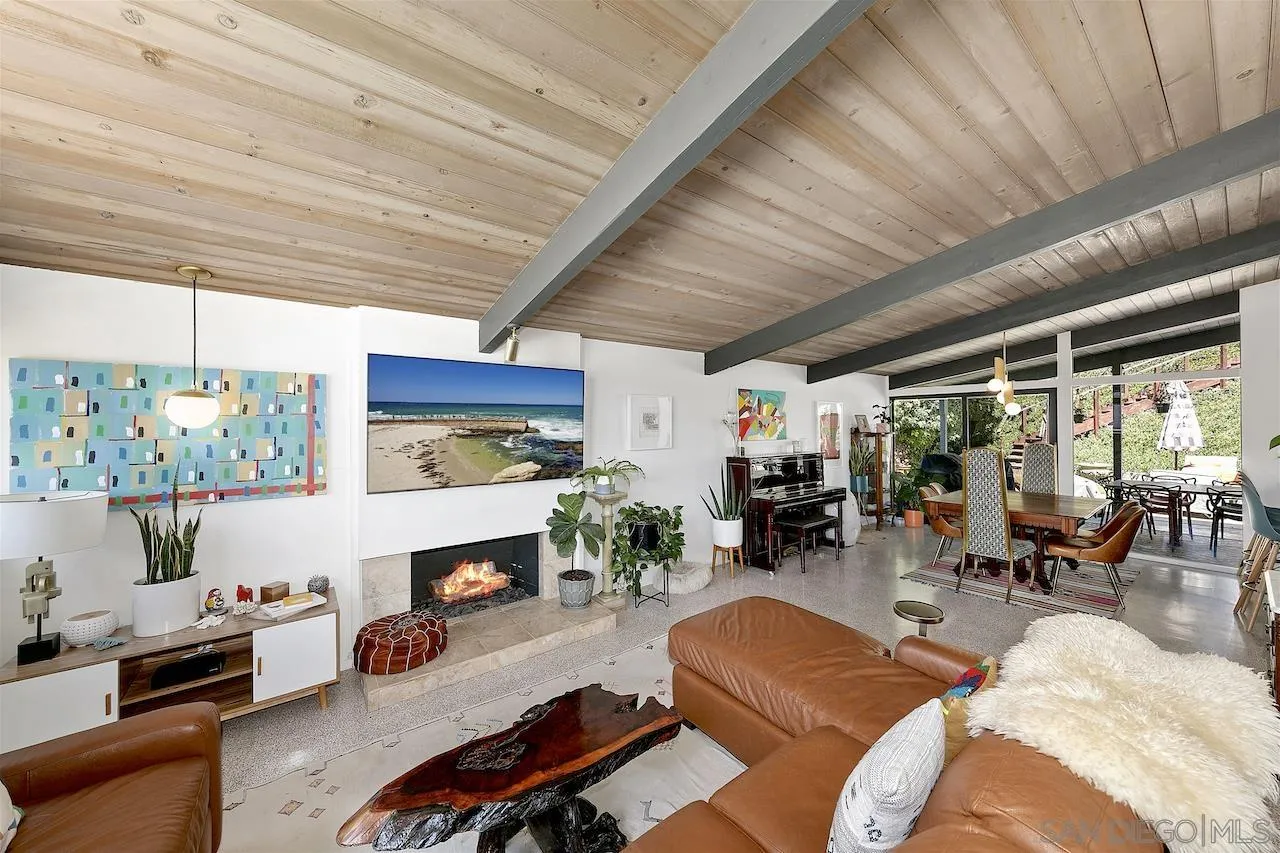 5635 Dartford Way San Diego, CA 92120 - Photo 4 of 26 a living room with furniture fireplace and a flat screen tv