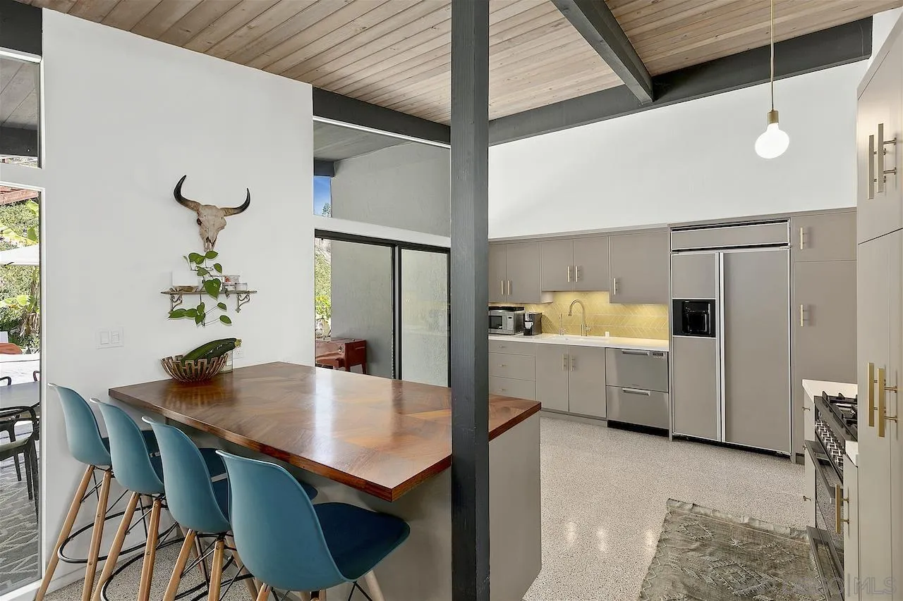 5635 Dartford Way San Diego, CA 92120 - Photo 6 of 26 a kitchen with a table and chairs