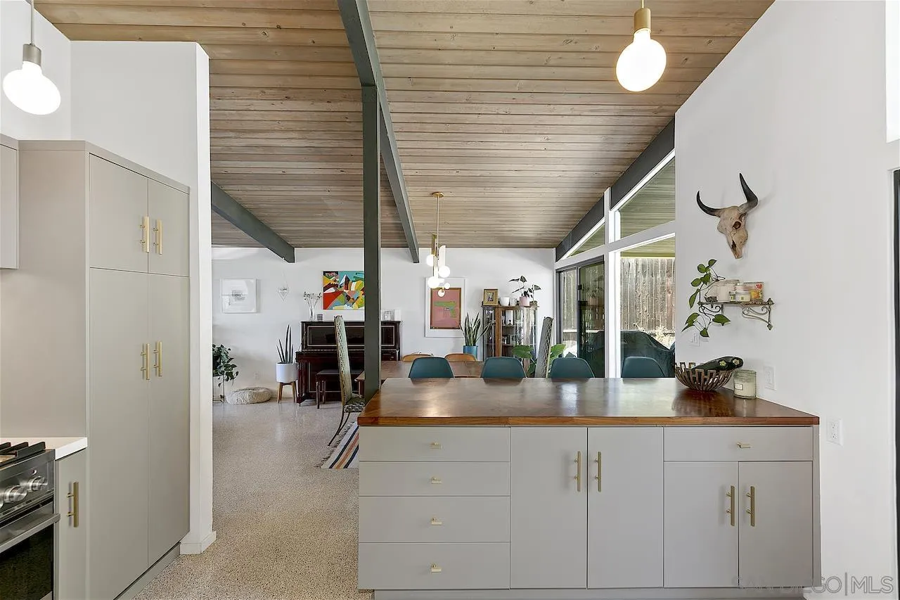 5635 Dartford Way San Diego, CA 92120 - Photo 8 of 26 a room with lots of counter space and wooden floor