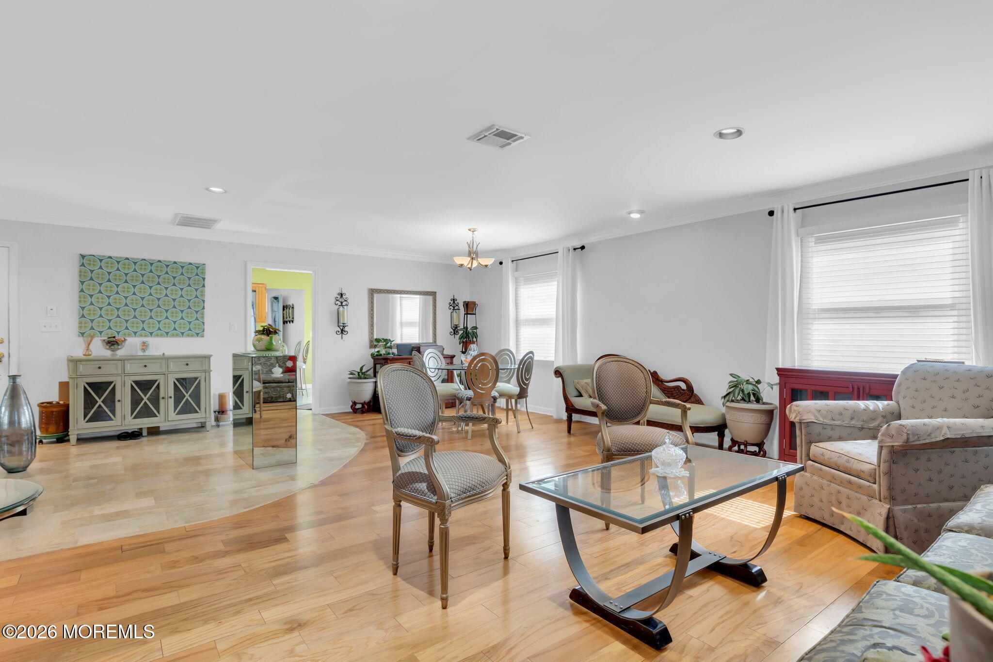 101 Andover Lane Matawan, NJ 07747 - Photo 14 of 51 a living room with furniture a wooden floor and a window