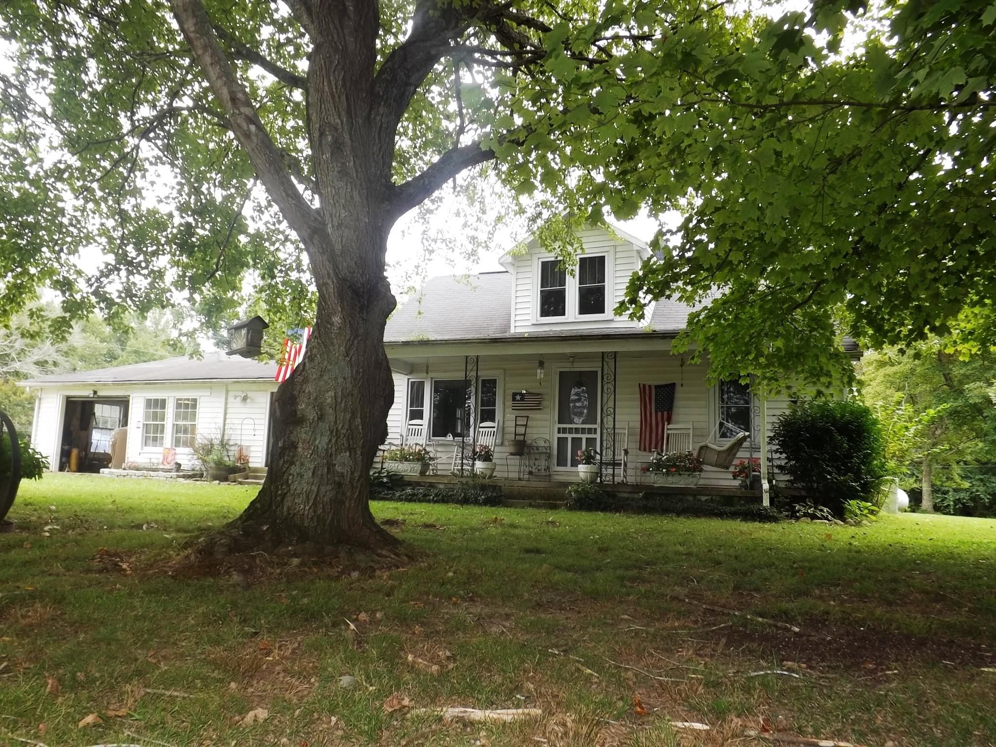 540 Parker Road Manchester, TN 37355 - Photo 1 of 30 a front view of a house with garden