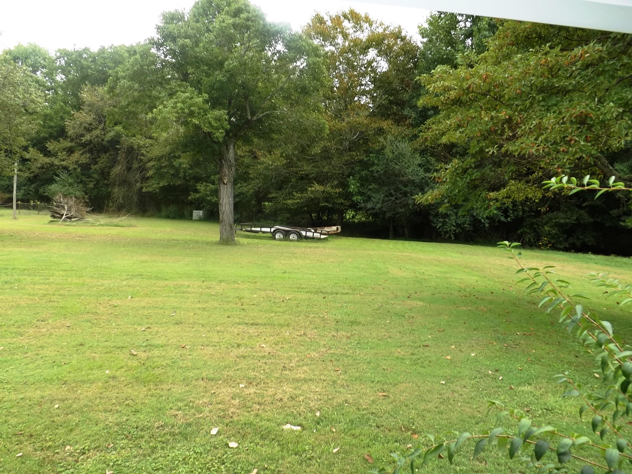 540 Parker Road Manchester, TN 37355 - Photo 11 of 30 a view of a field with an trees in the background