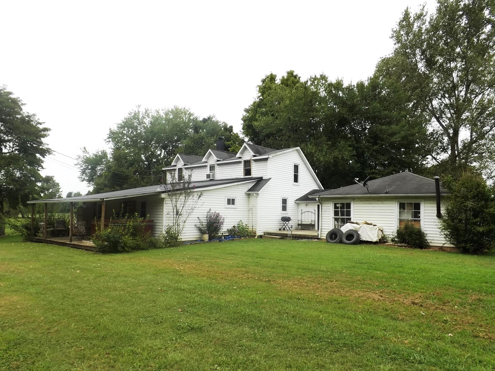 540 Parker Road Manchester, TN 37355 - Photo 3 of 30 a view of a white house that has a yard