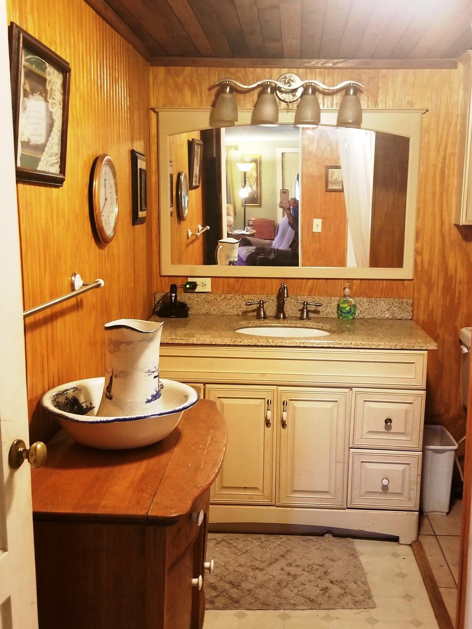540 Parker Road Manchester, TN 37355 - Photo 22 of 30 a bathroom with a sink and a mirror