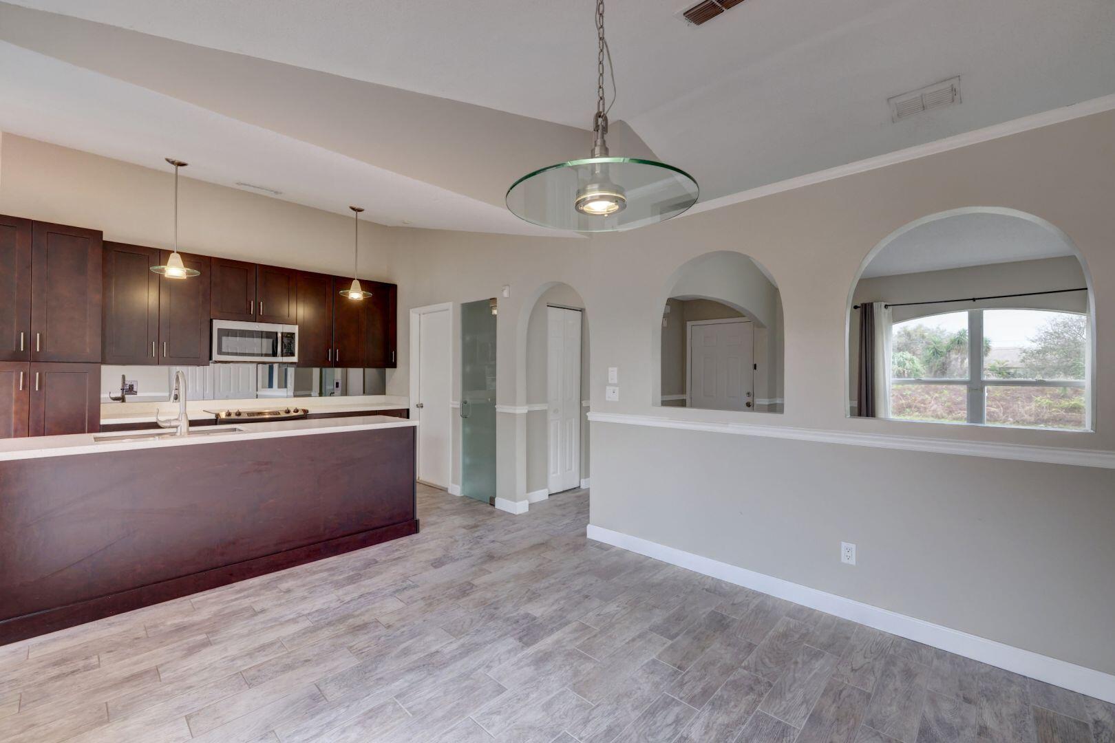 817 Southwest Commonwealth Road Port St. Lucie, FL 34953 - Photo 7 of 39 Dining Room - Kitchen