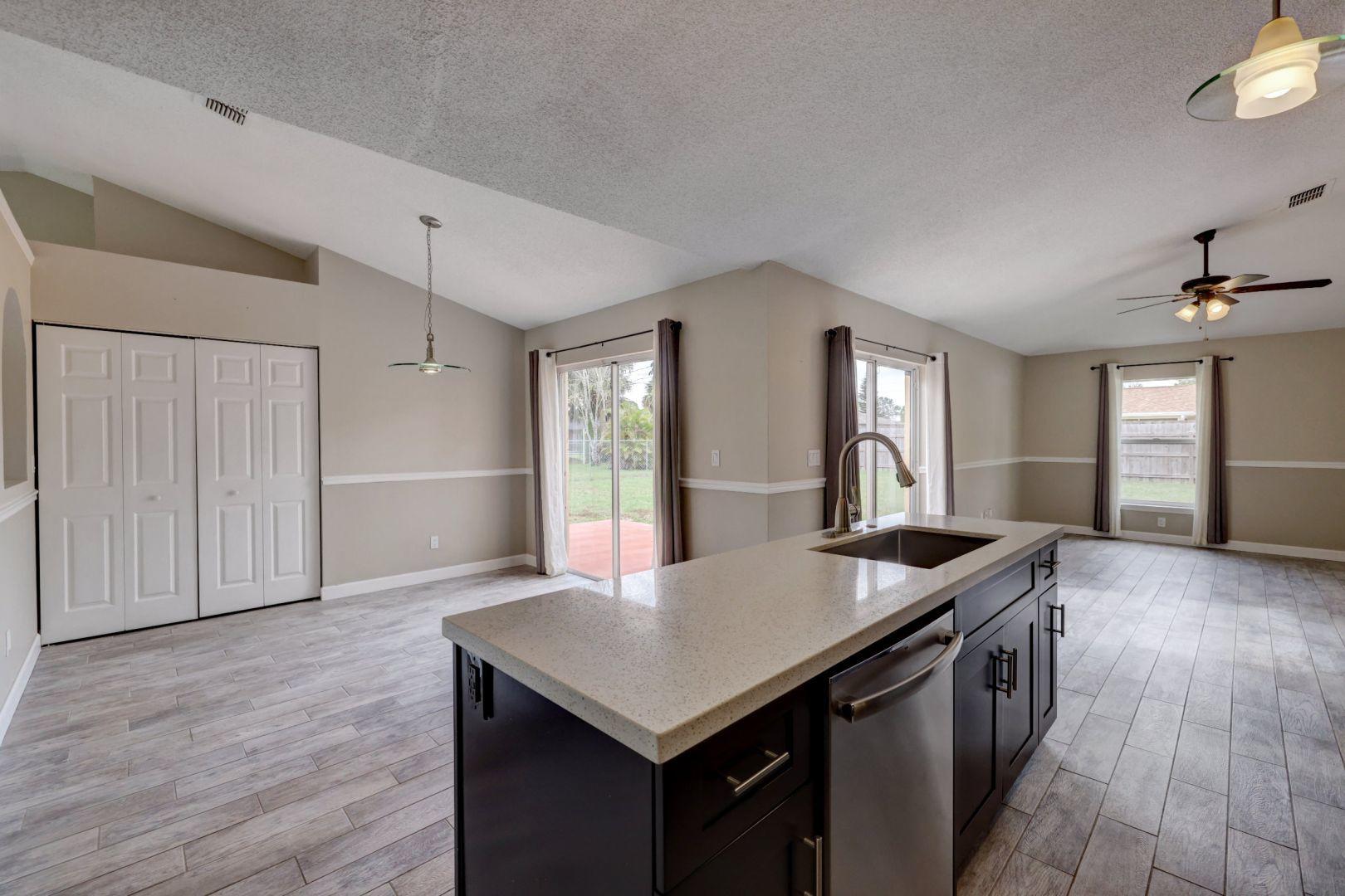 817 Southwest Commonwealth Road Port St. Lucie, FL 34953 - Photo 10 of 39 Kitchen - Dining - Family