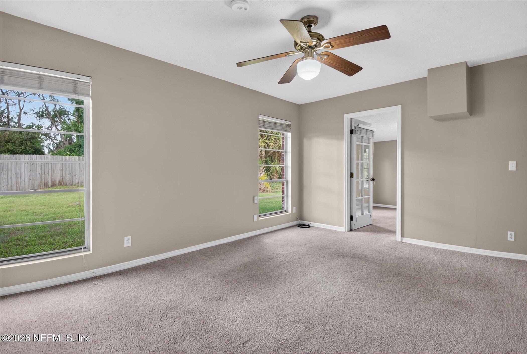 2705 Navajo Road Orange Park, FL 32073 - Photo 38 of 58 an empty room with fan and windows