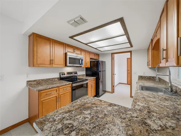 a view of a livingroom with a ceiling fan and window