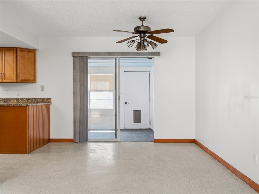 3303 Orange Tree Drive Edgewater, FL 32141 - Photo 14 of 33 a view of empty room with ceiling fan
