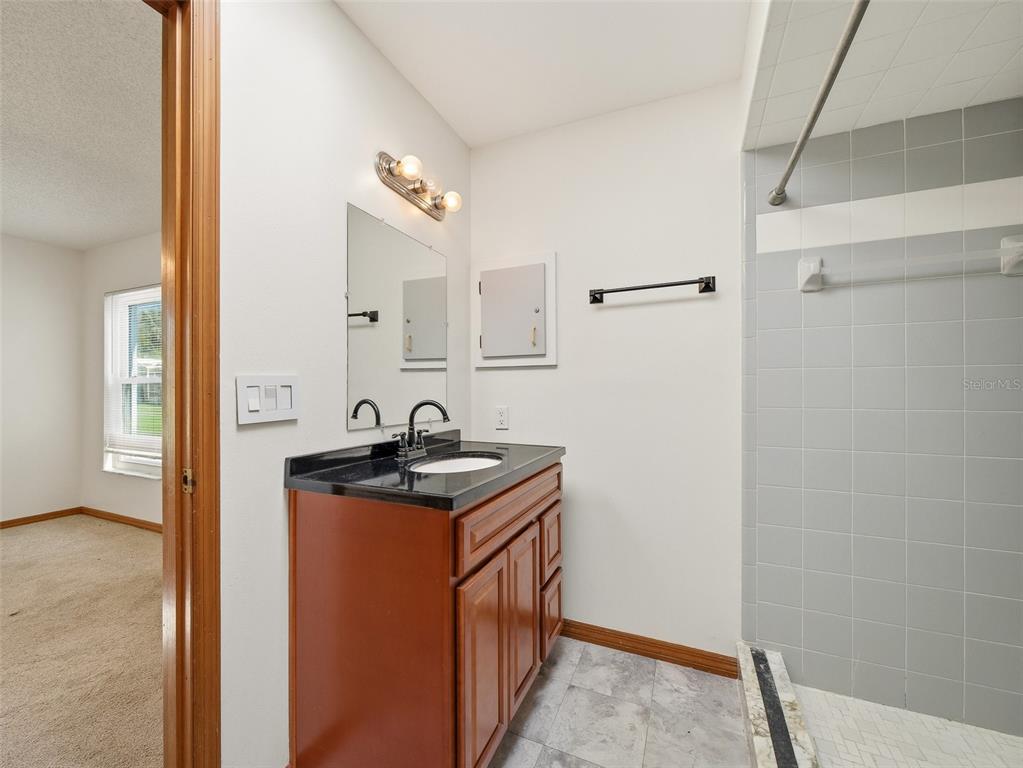 3303 Orange Tree Drive Edgewater, FL 32141 - Photo 20 of 33 a kitchen with stainless steel appliances granite countertop a sink stove and refrigerator
