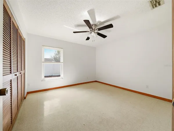 a view of a room with a sink and cabinets