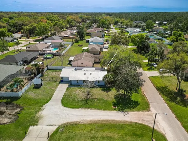 a view of empty room with a ceiling fan and window