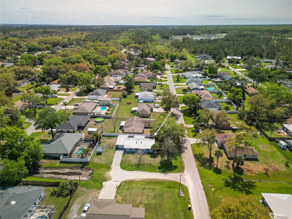 3303 Orange Tree Drive Edgewater, FL 32141 - Photo 31 of 33 an aerial view of residential houses with outdoor space