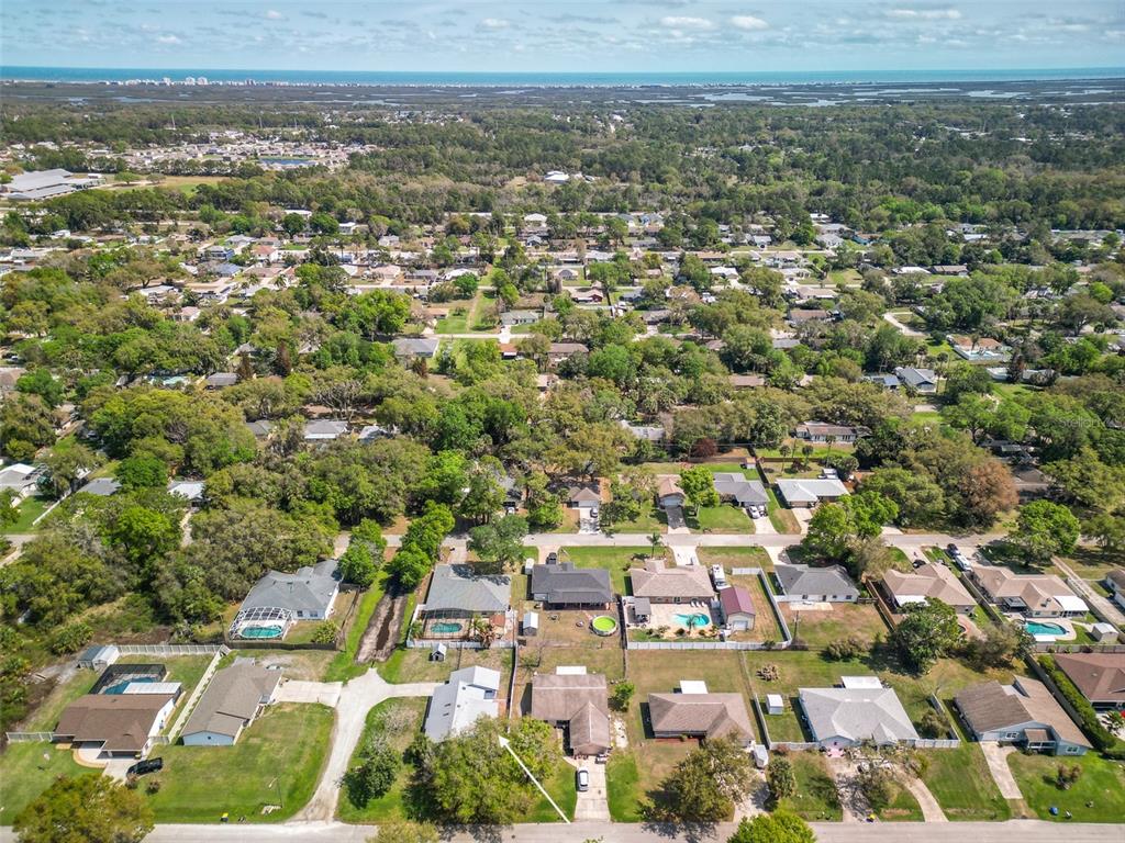 3303 Orange Tree Drive Edgewater, FL 32141 - Photo 33 of 33 an aerial view of residential houses with city view