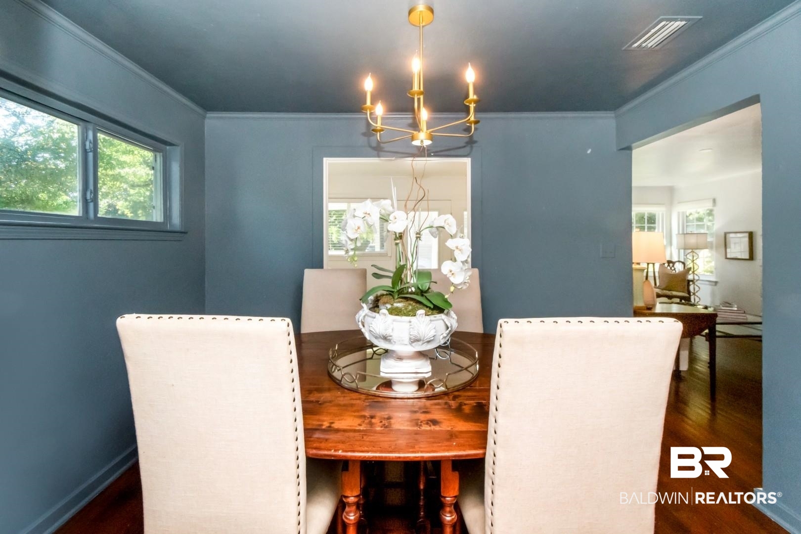 18 Princess Anne Road Mobile, AL 36608 - Photo 9 of 41 Dining space featuring ornamental molding, dark wood-type flooring, and a chandelier