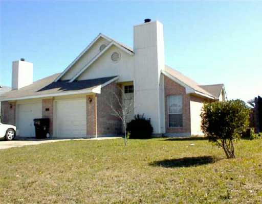 12319 Turtle Rock Road Austin, TX 78729 - Photo 1 of 1 a view of a house with a yard
