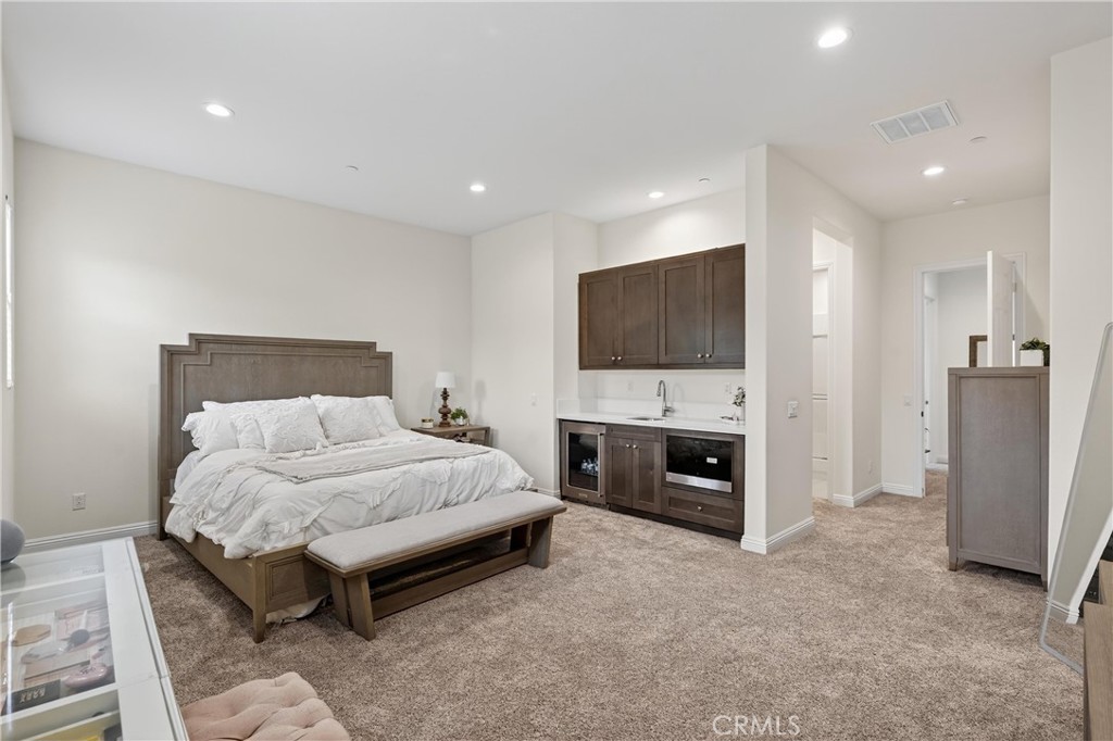 17549 Bretton Woods Place Riverside, CA 92504 - Photo 26 of 38 Equipped with mini-fridge, microwave and sink area