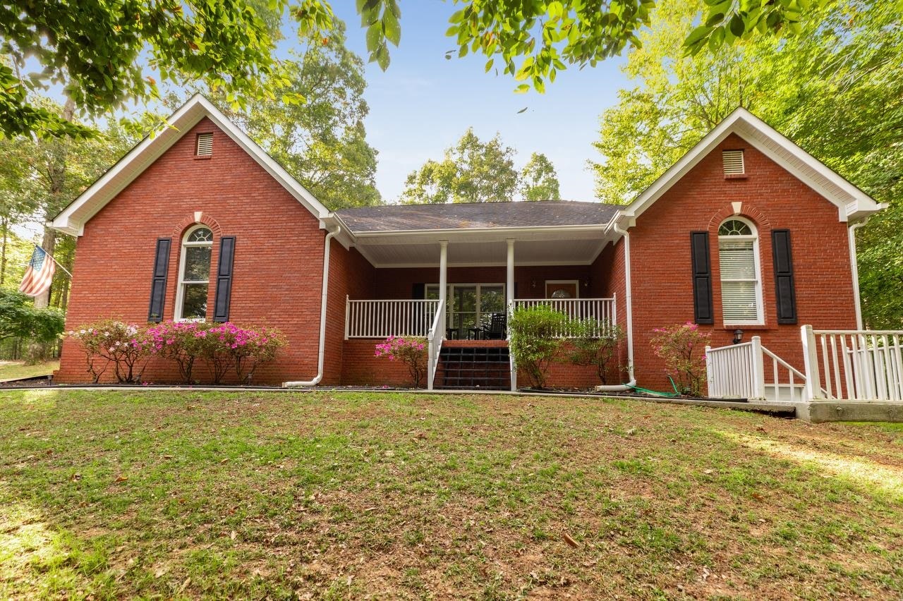 449 McKenzie Bridge Road Carrollton, GA 30116 - Photo 1 of 1 a front view of a house with a yard