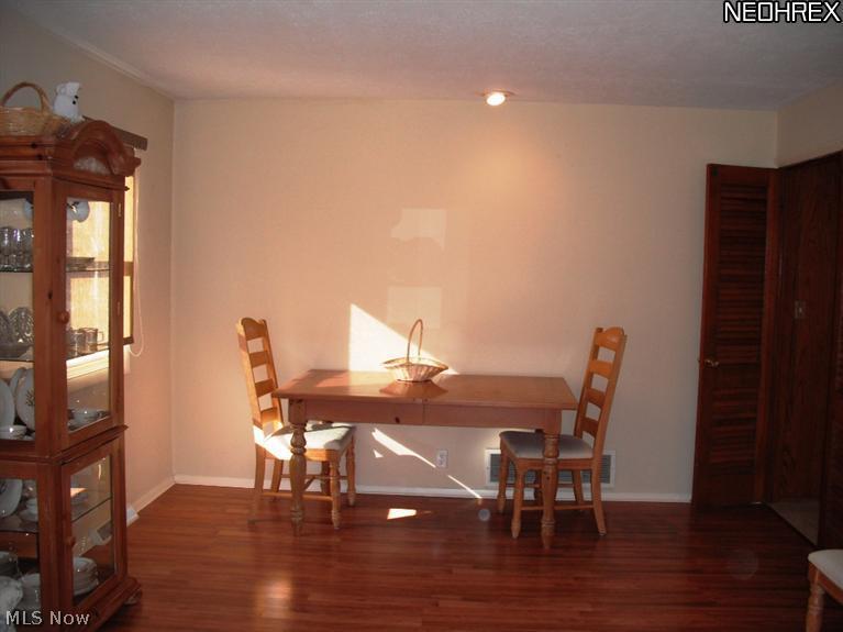 6610 Chestnut Road Independence, OH 44131 - Photo 3 of 19 dining room feature wood-look laminate flooring