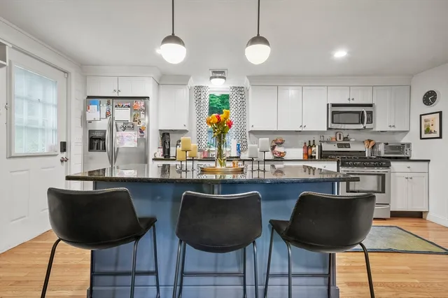 a kitchen with granite countertop counter space a sink stainless steel appliances and cabinets