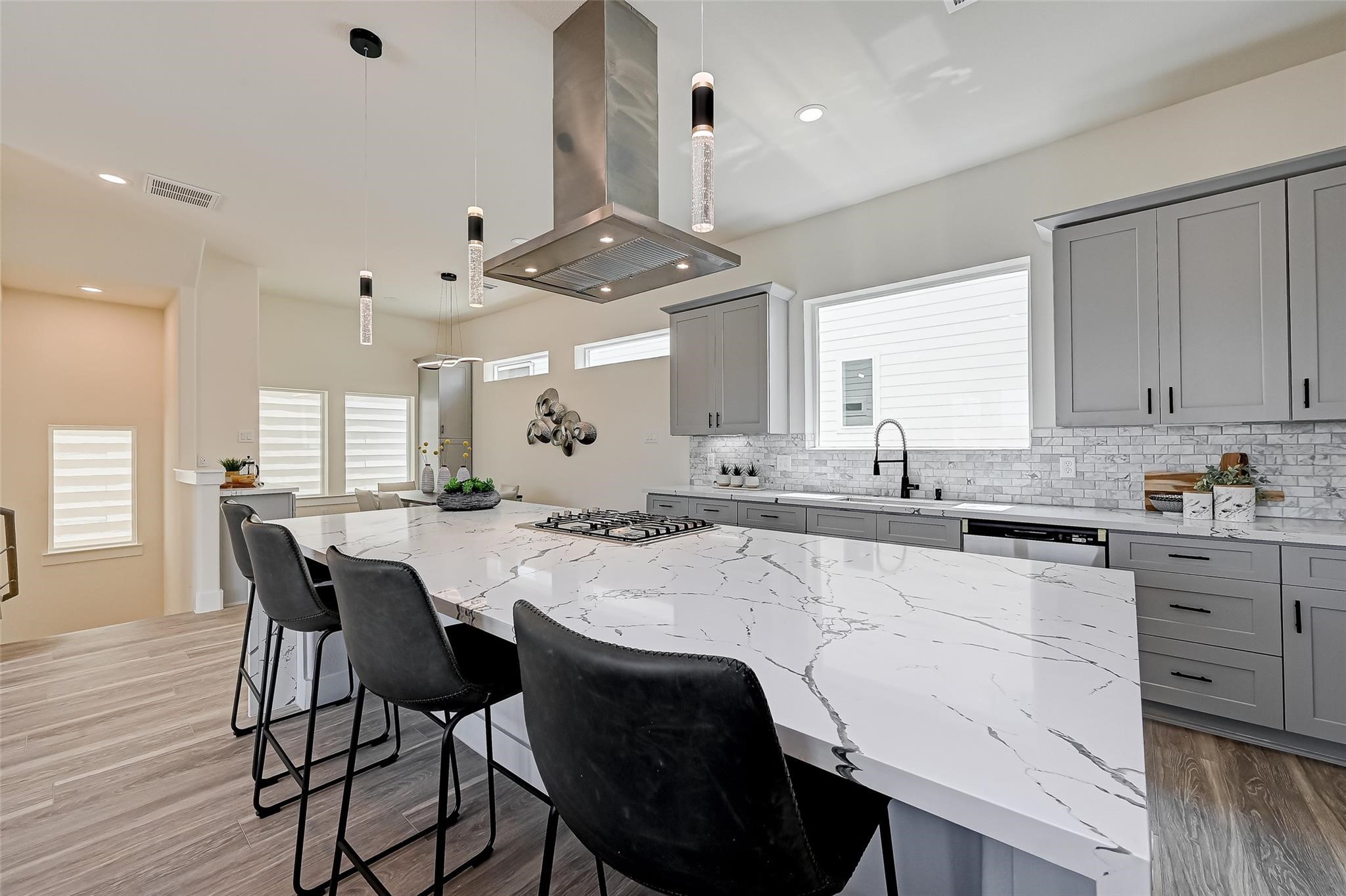 2905 Nagle Street Houston, TX 77004 - Photo 14 of 41 a kitchen with stainless steel appliances kitchen island a stove a table and chairs in it