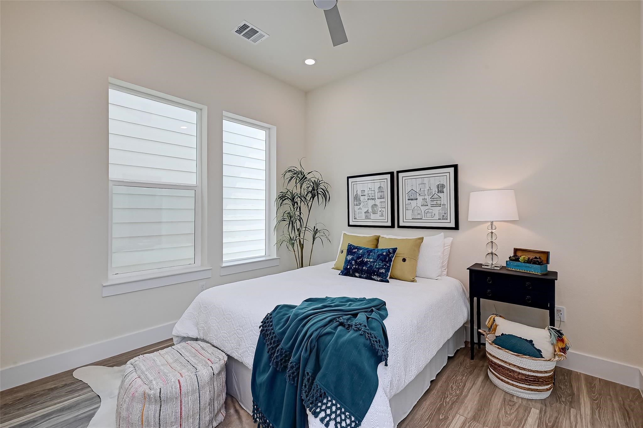 2905 Nagle Street Houston, TX 77004 - Photo 23 of 41 a bedroom with a bed and a chair