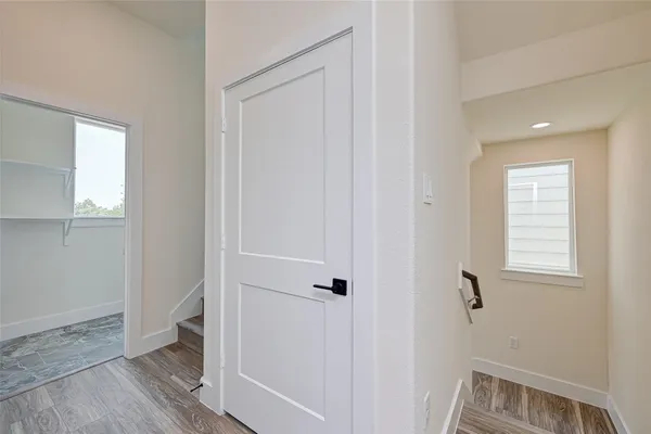 a view of room with window and hardwood floor