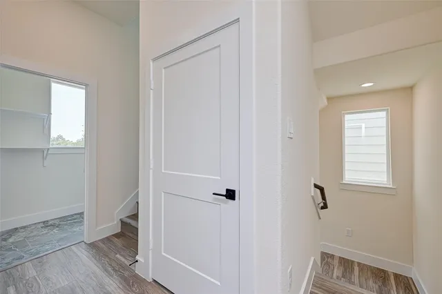 a view of room with window and hardwood floor
