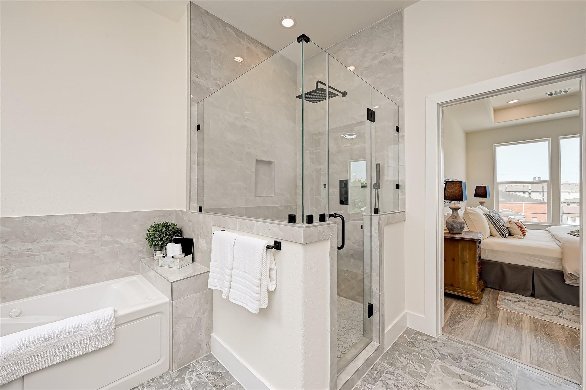 2905 Nagle Street Houston, TX 77004 - Photo 32 of 41 a bathroom with a tub shower and mirror