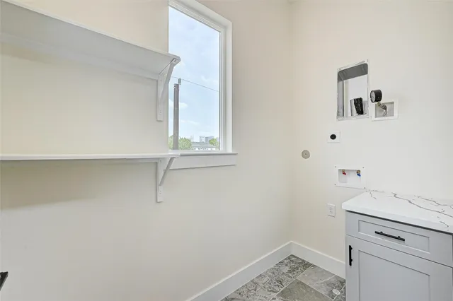 a bathroom with a sink and vanity