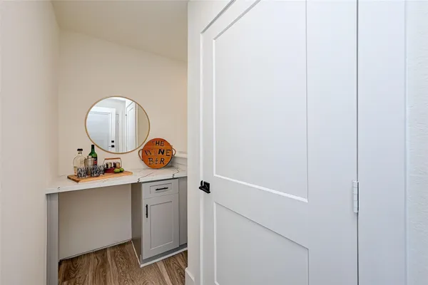 a room with a sink and a mirror