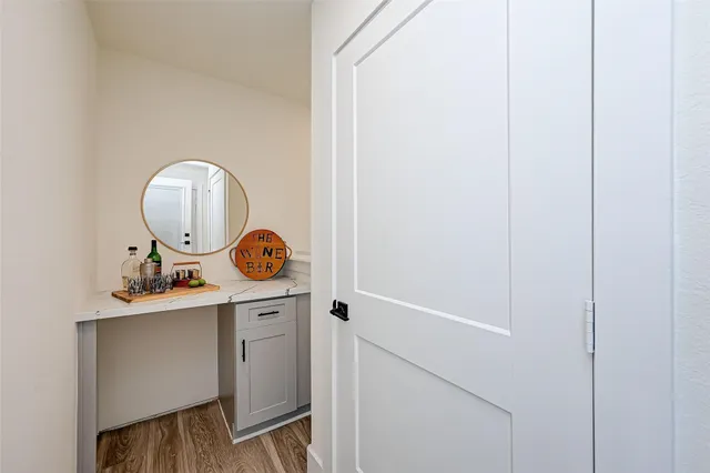 a room with a sink and a mirror