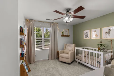 a bedroom with furniture and a window
