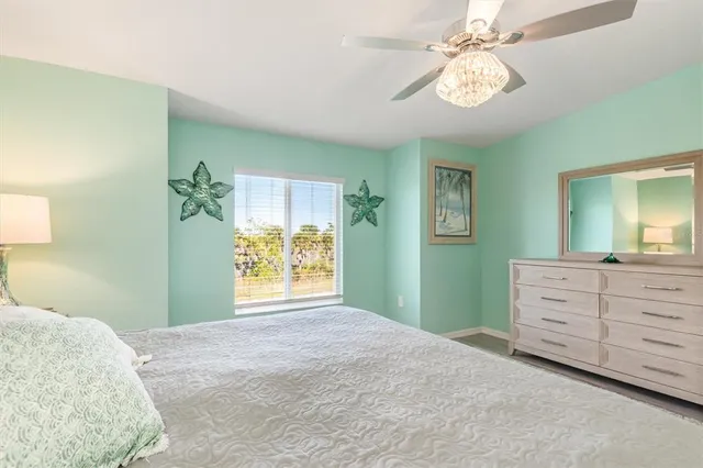 a bedroom with a bed and a mirror