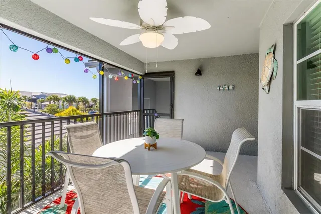 a view of a dining room with furniture a chandelier and wooden floor