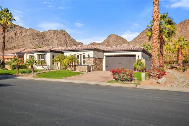 front view of a house with a garden