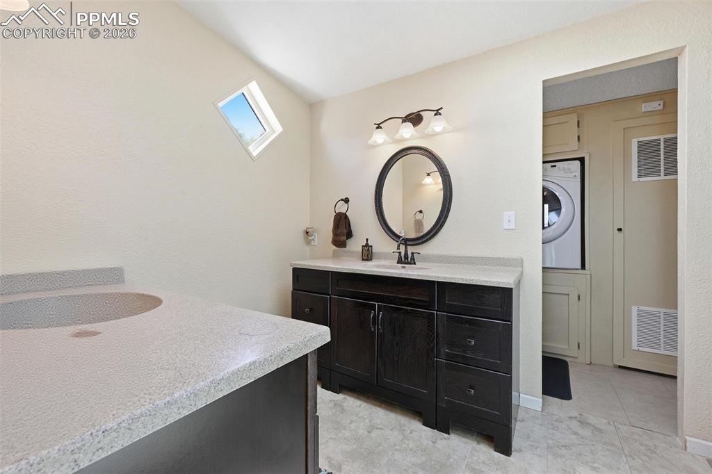 20985 McDaniels Road Calhan, CO 80808 - Photo 30 of 41 a bathroom with a sink and a mirror
