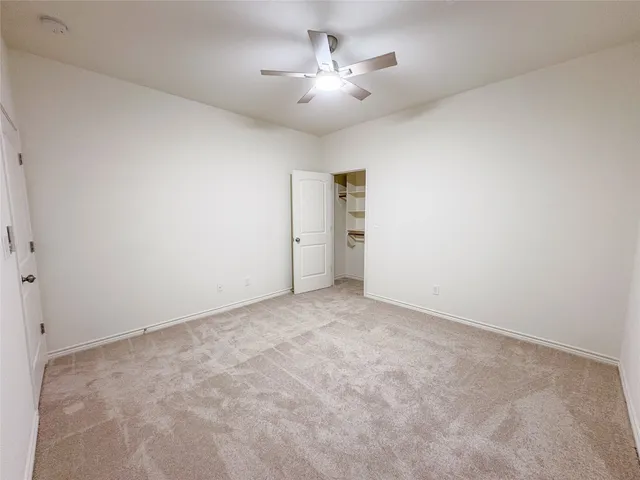 a view of a livingroom with a chandelier fan