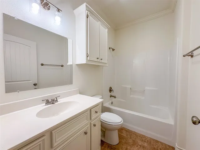 a bathroom with a sink toilet a vanity and bathtub