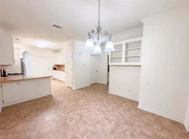 a view of a kitchen with a sink