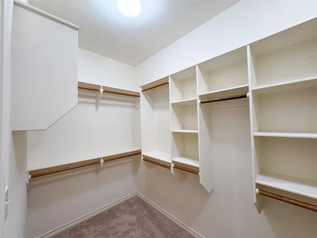 a view of an empty walk in closet