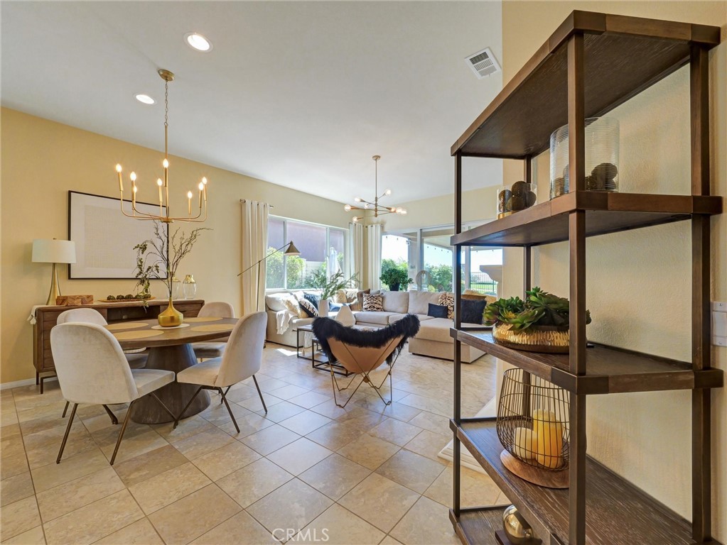 887 Westchester Road Beaumont, CA 92223 - Photo 16 of 41 a view of a dining room with furniture and window