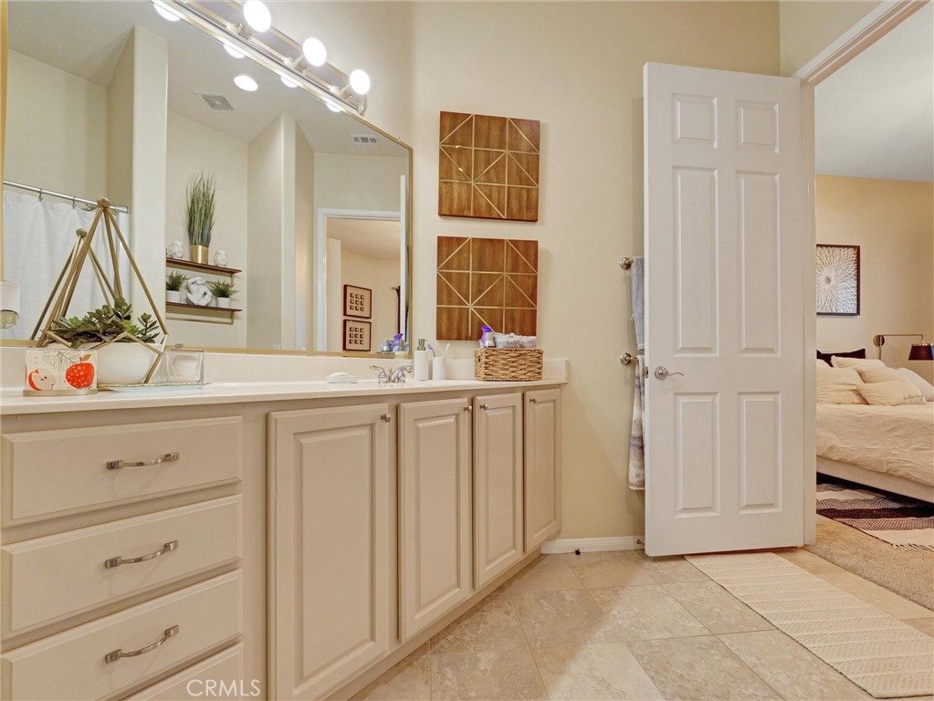 887 Westchester Road Beaumont, CA 92223 - Photo 25 of 41 a bathroom with a sink double vanity