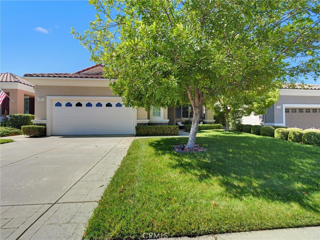 887 Westchester Road Beaumont, CA 92223 - Photo 3 of 41 a front view of a house with a yard