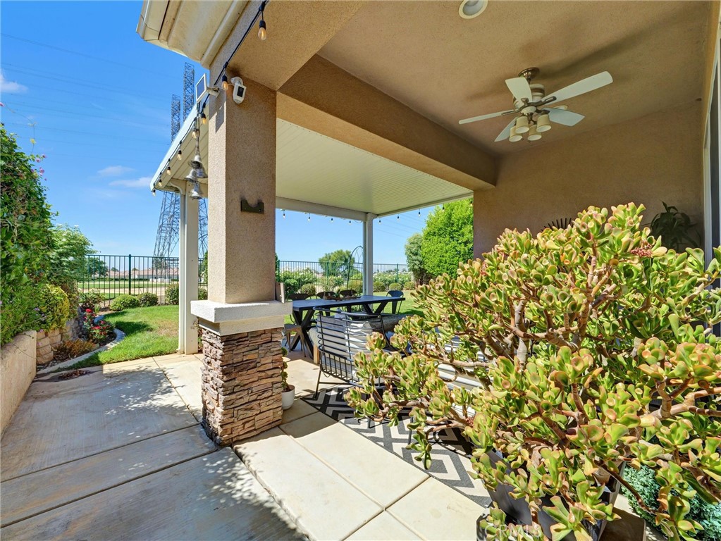 887 Westchester Road Beaumont, CA 92223 - Photo 38 of 41 a view of a chairs and table in the patio
