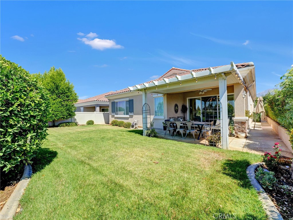 887 Westchester Road Beaumont, CA 92223 - Photo 39 of 41 a view of a house with backyard porch and sitting area