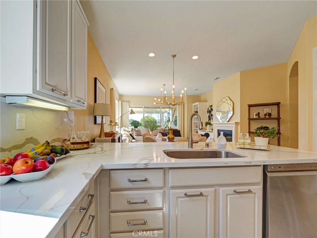 887 Westchester Road Beaumont, CA 92223 - Photo 8 of 41 a kitchen with counter top space and sink