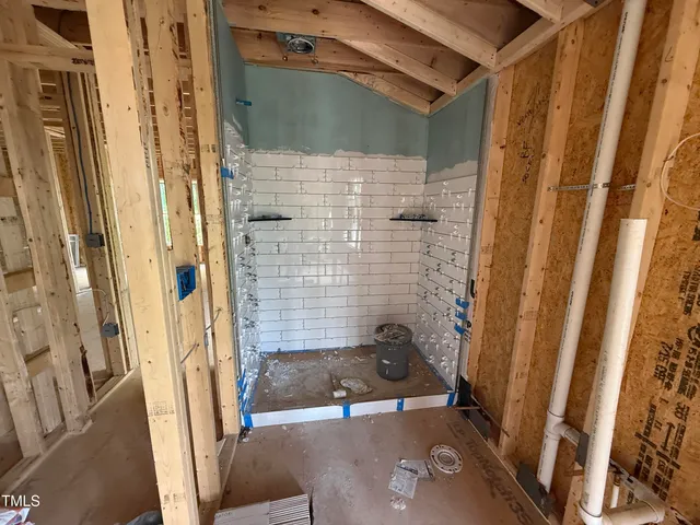 a bathroom with a tub and shower