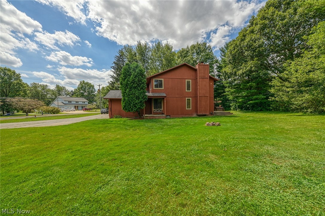 2715 Graham Road, Unit 4 Stow, OH 44224 - Photo 5 of 35 2715 Graham Rd #4, Stow, OH 44224 is an end unit condominium with 2 bedrooms, 1.5 bathrooms, 1 car garage, finished basement, laundry in lower level, huge side yard with pet fence & 3 collars provided, open floor plan from galley kitchen with oak cabinets & appliances to the large living room with wood burning fireplace, sliding glass doors to rear deck and sitting porch up front.